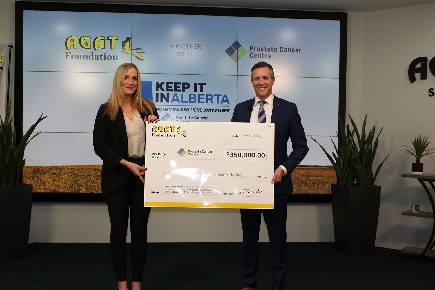 Marissa Reckmann, CEO of AGAT Laboratories, presenting a donation cheque to the Prostate Cancer Centre.